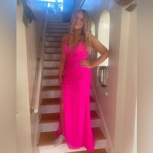 Elegant Hot Pink Evening Gown. Open back. Jewels all over the bodice.